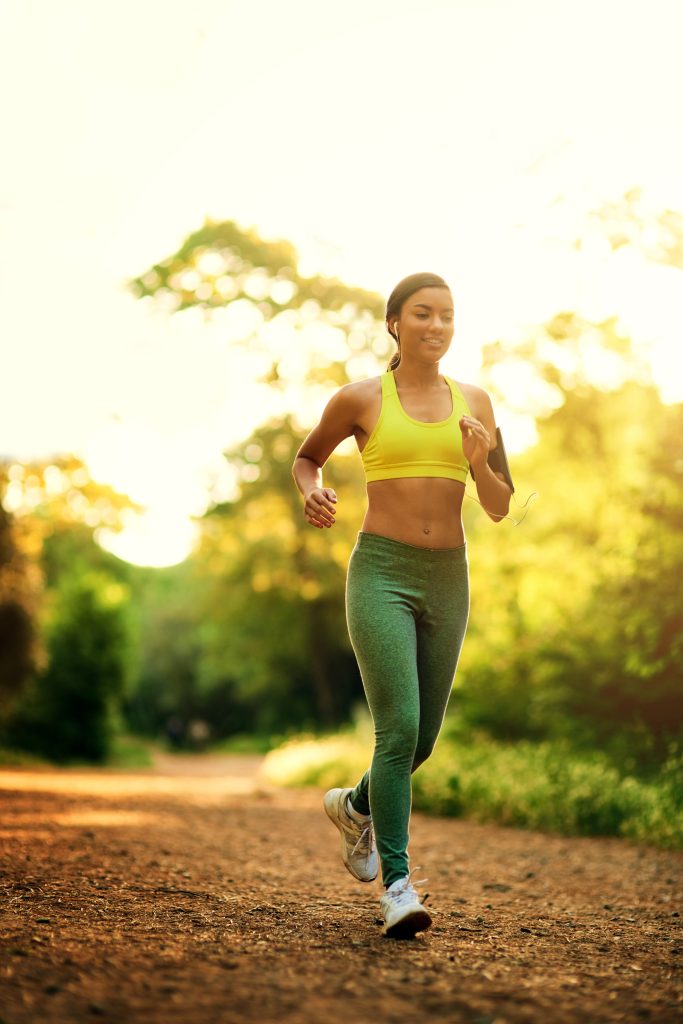 Im on the run. Shot of a young woman running in a natural enviro