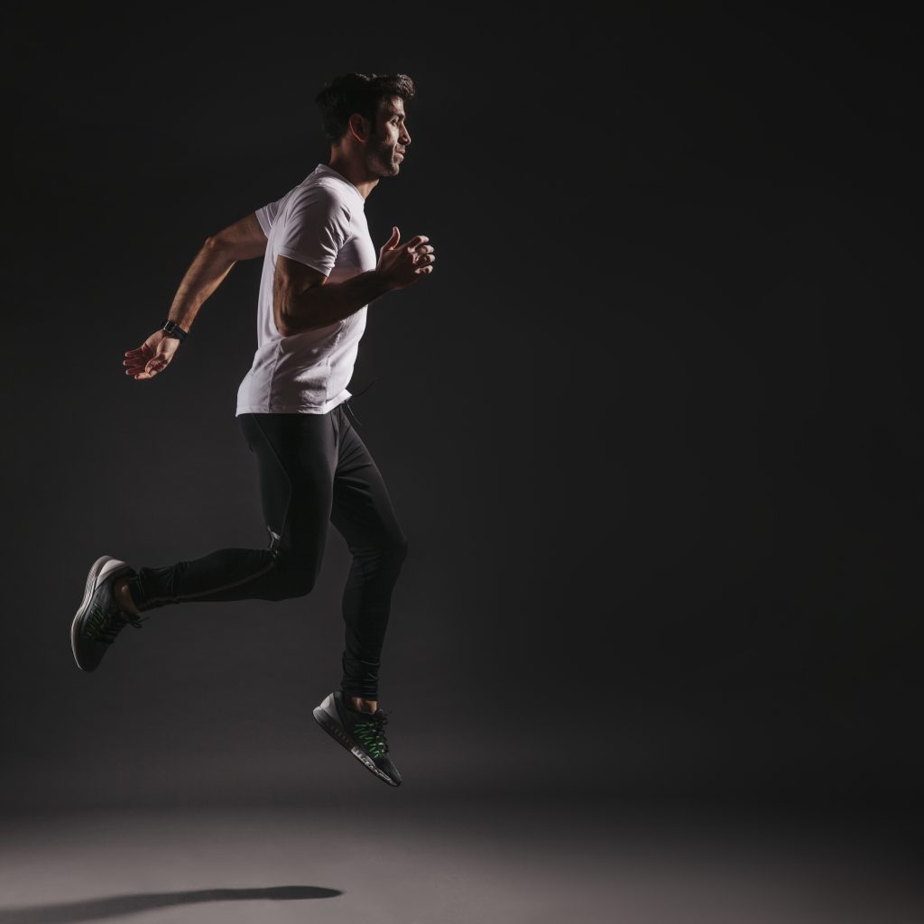 man-leaping-dark-background