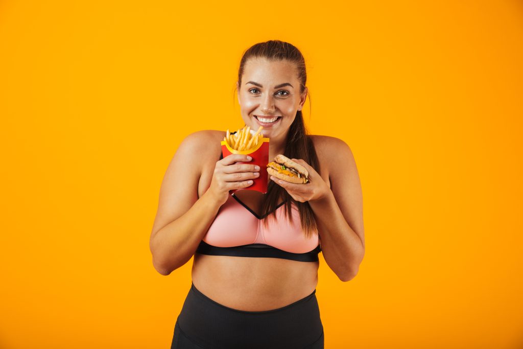 Portrait of a happy overweight fitness woman