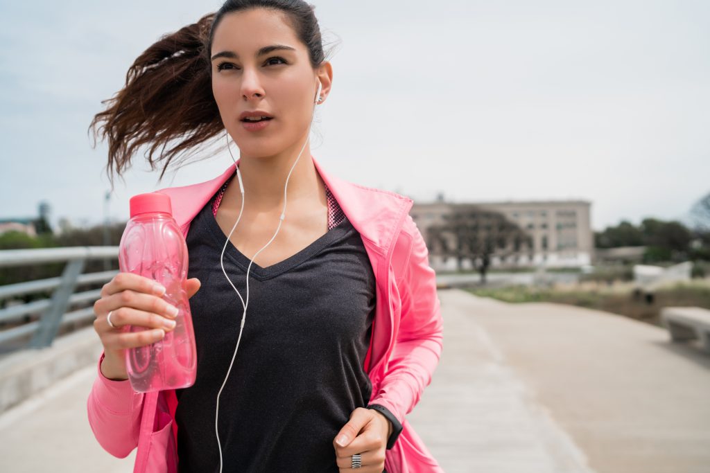 Portrait of fitness woman running.