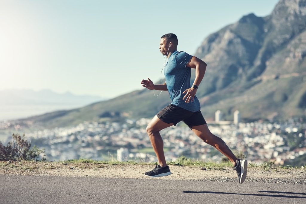 Running is one of the best ways to stay fit. Shot of a young han