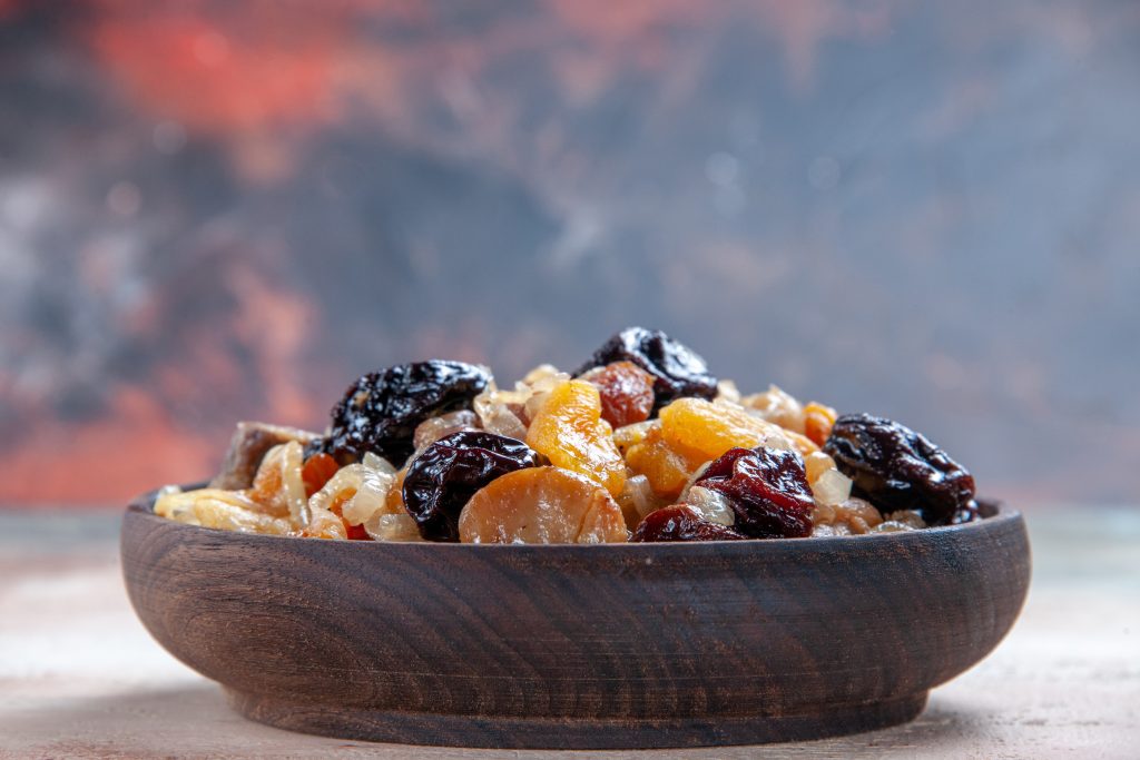 side-close-up-view-pilaf-appetizing-rice-with-chestnuts-table